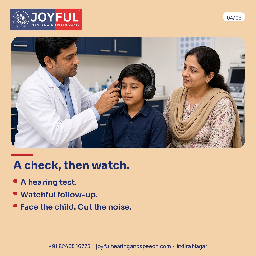 A clinician fits headphones on a boy while his mother sits beside him. A hearing check, then watchful follow-up.