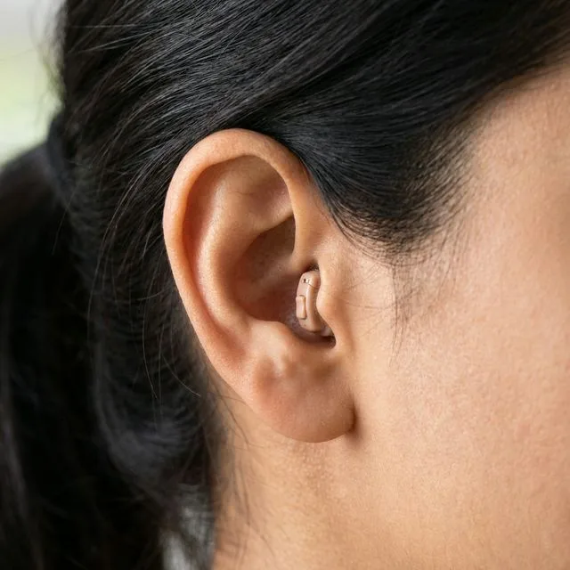 Person wearing IIC Invisible Hearing Aid